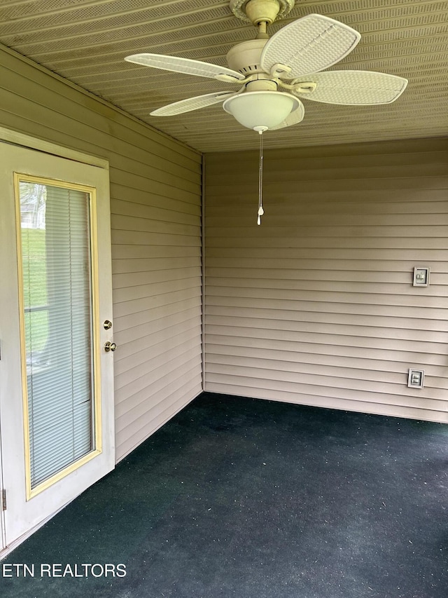 exterior space with ceiling fan