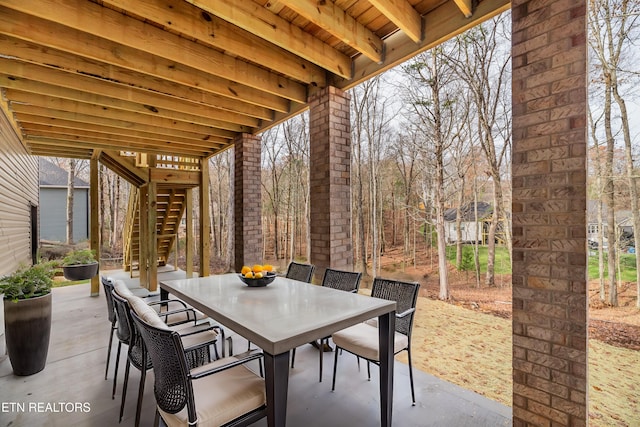 view of patio / terrace with stairway and outdoor dining area