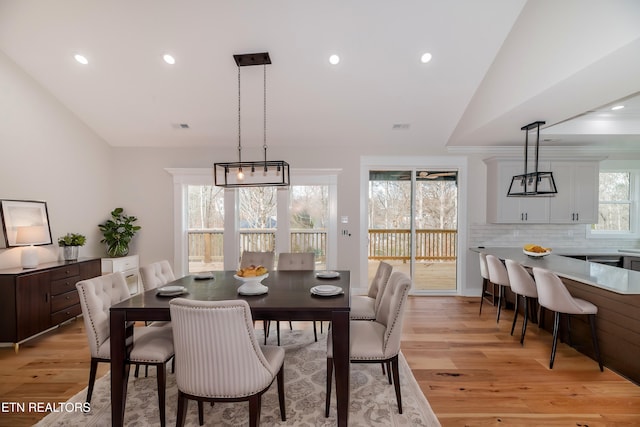 dining area with recessed lighting, light wood-style flooring, visible vents, and lofted ceiling