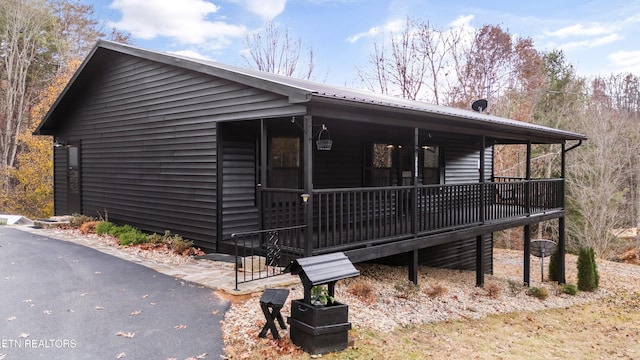 view of property exterior featuring a porch