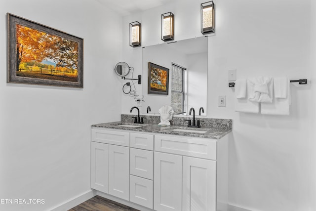 bathroom featuring hardwood / wood-style floors and vanity