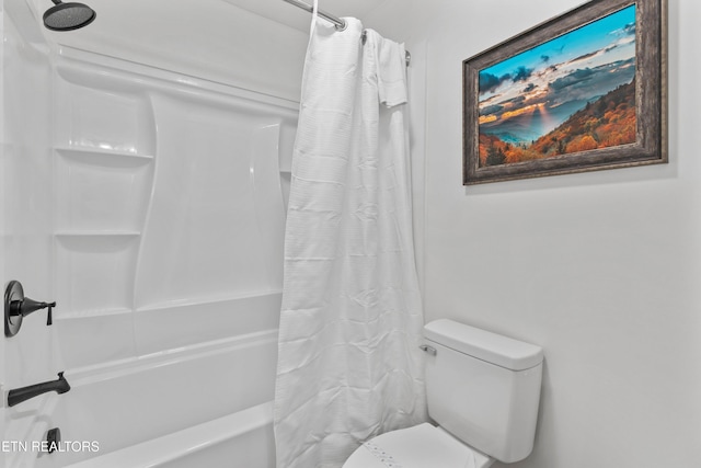 bathroom with shower / bath combo and toilet