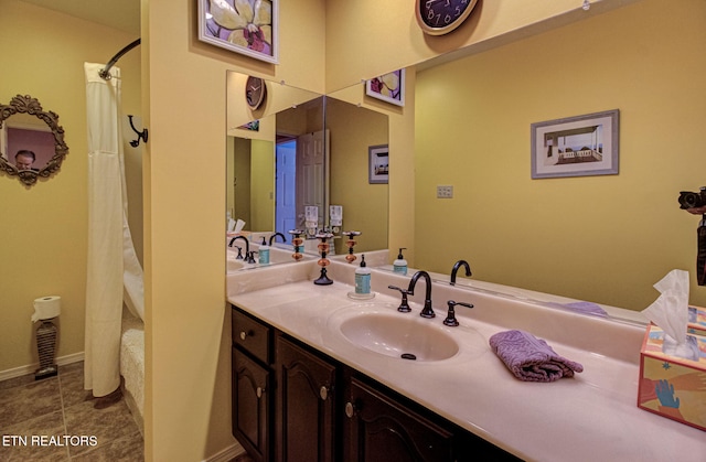 bathroom featuring vanity, tile patterned floors, and shower / tub combo with curtain