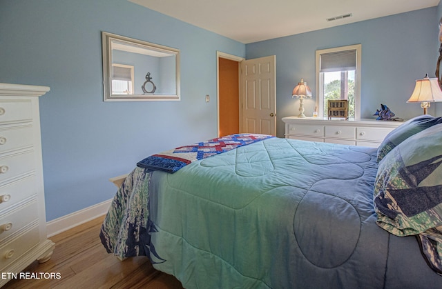 bedroom featuring light hardwood / wood-style floors