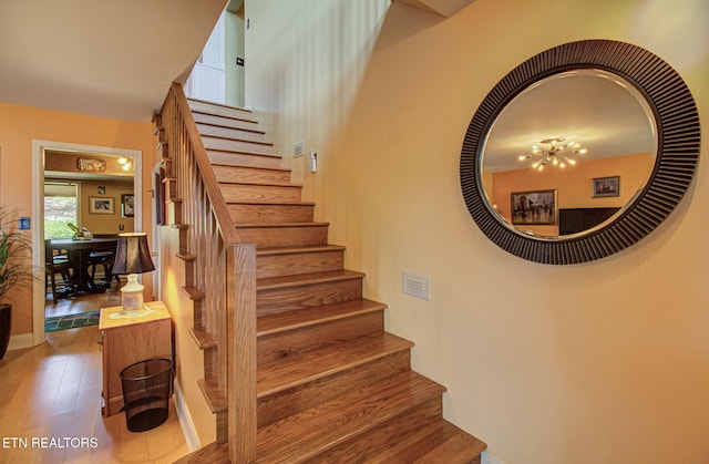 stairway with wood-type flooring