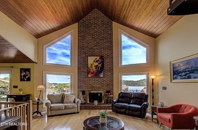 living room with wooden ceiling, high vaulted ceiling, and light hardwood / wood-style flooring