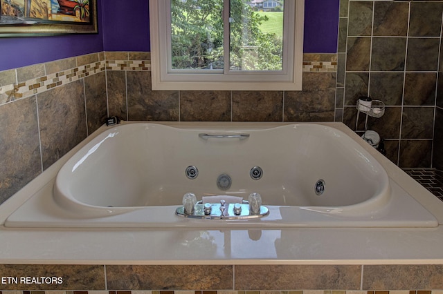 bathroom with tiled bath