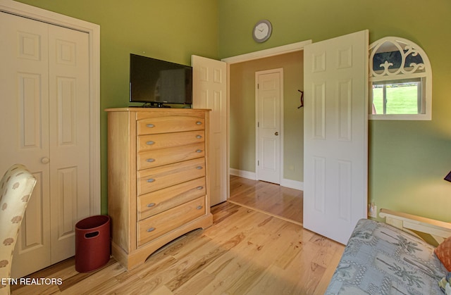 bedroom featuring hardwood / wood-style flooring and a closet