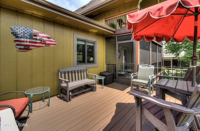 deck with a sunroom