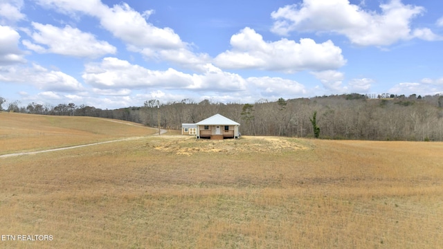 view of yard with a rural view