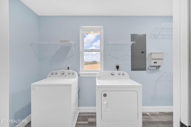 washroom featuring washer and dryer, dark hardwood / wood-style flooring, and electric panel