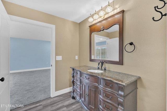 bathroom with vanity and wood-type flooring