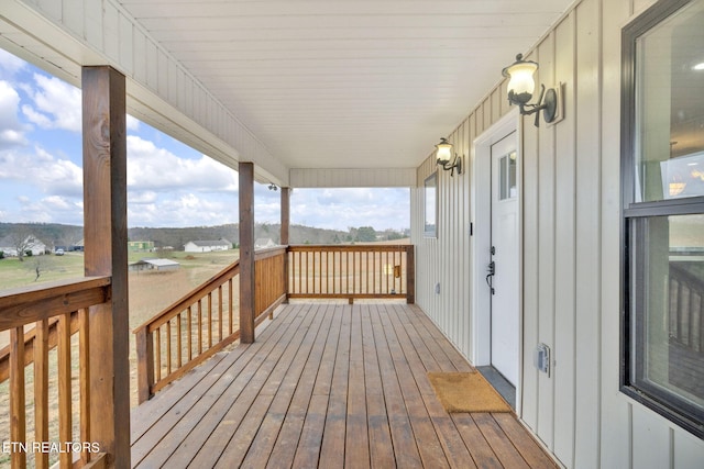 wooden terrace featuring covered porch