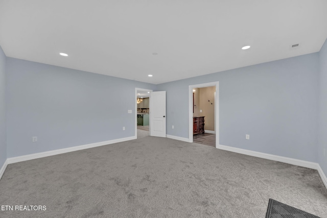 spare room featuring carpet floors