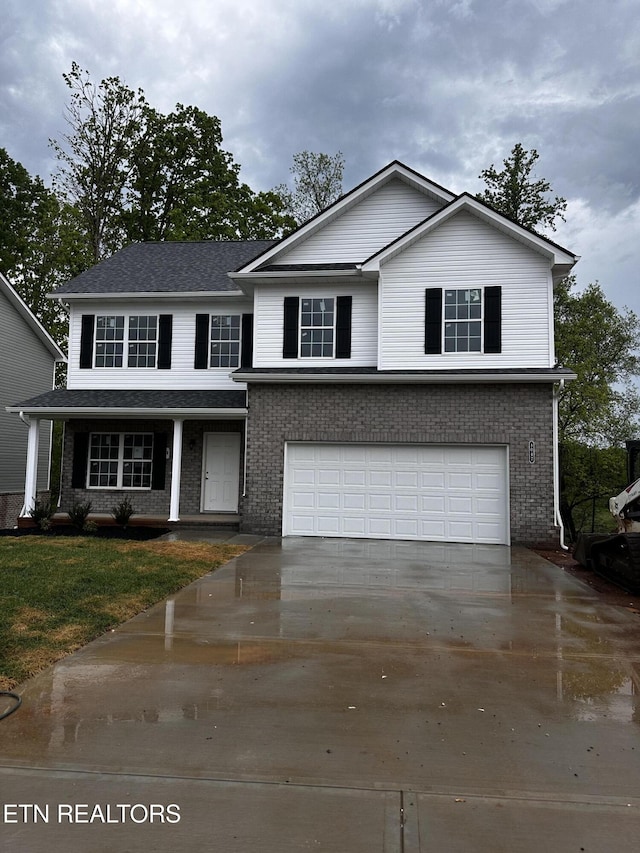 8047 Tree Line Ln, Corryton, TN 37721 - traditional-style home with a garage, driveway, and brick siding