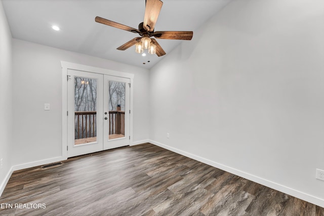 empty room featuring dark hardwood / wood-style floors, ceiling fan, and french doors