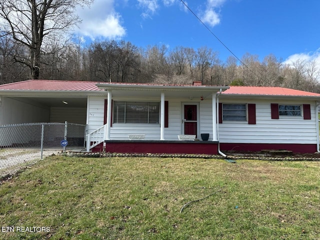 view of front of property with a carport, covered porch, and a front yard