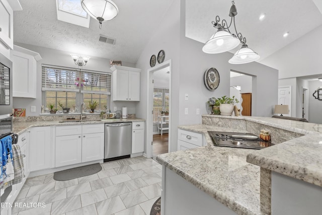 kitchen featuring pendant lighting, plenty of natural light, white cabinetry, and stainless steel appliances