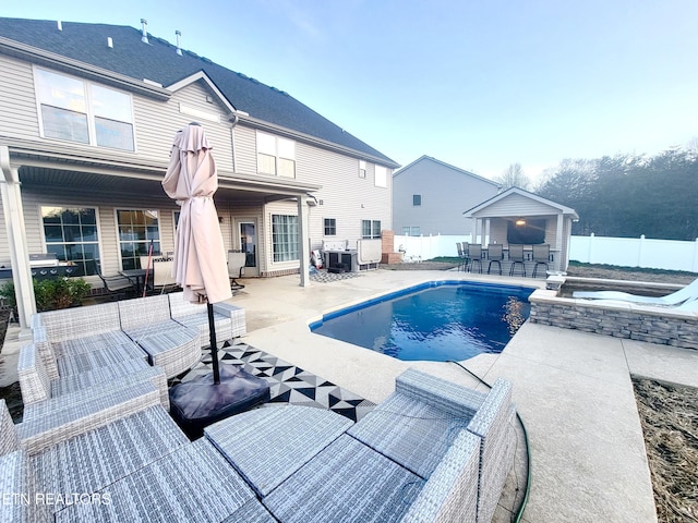 view of pool with a jacuzzi, a patio, and central AC