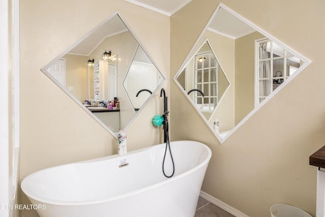 bathroom featuring tile patterned floors and a tub