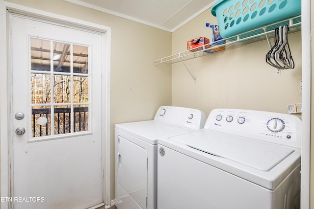 clothes washing area with washing machine and dryer