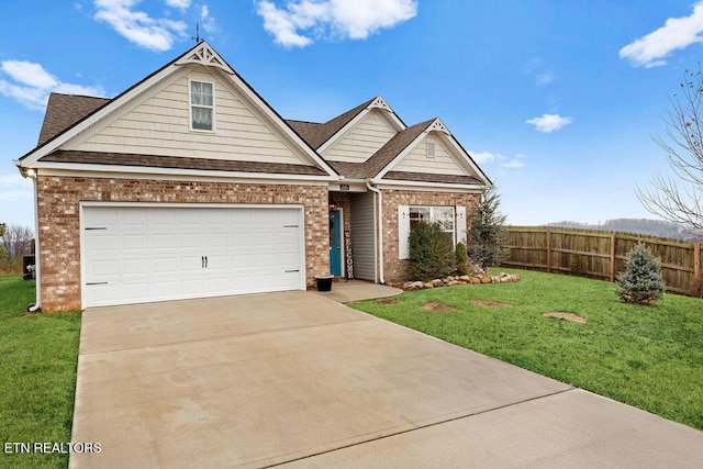 view of front facade with a garage and a front lawn