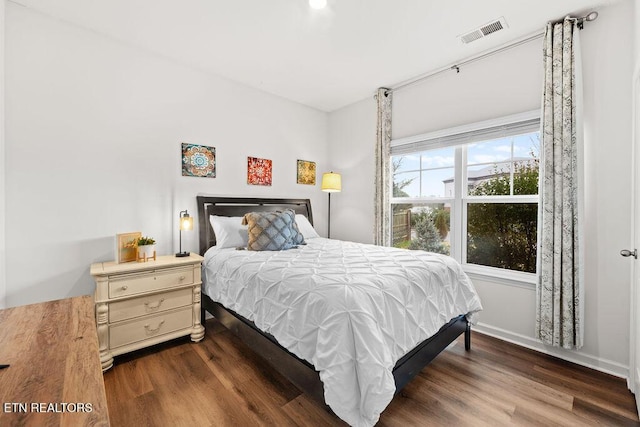 bedroom featuring dark hardwood / wood-style floors