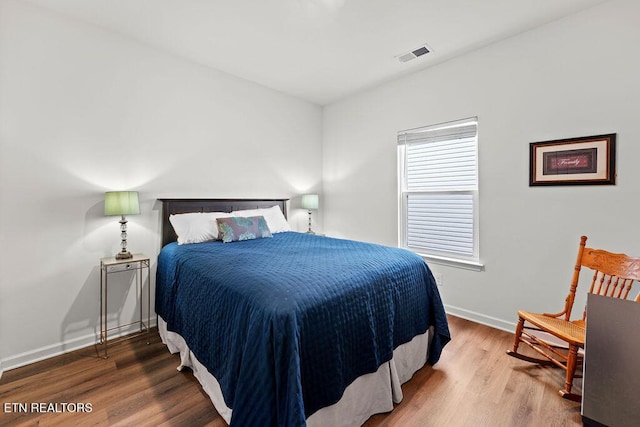 bedroom featuring hardwood / wood-style flooring