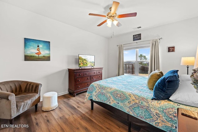 bedroom with hardwood / wood-style flooring and ceiling fan