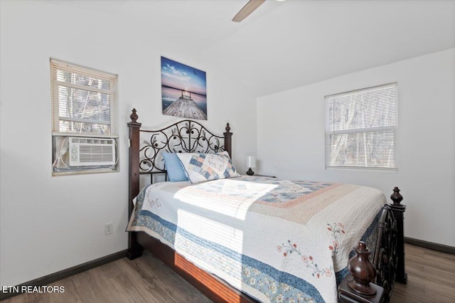 291 Marina Ln, Lafollette, TN 37766 - bedroom with ceiling fan, cooling unit, and wood-type flooring