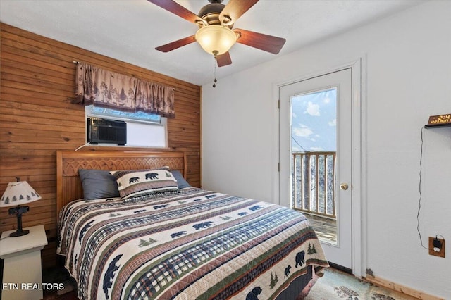 291 Marina Ln, Lafollette, TN 37766 - bedroom featuring access to exterior, ceiling fan, and wood walls