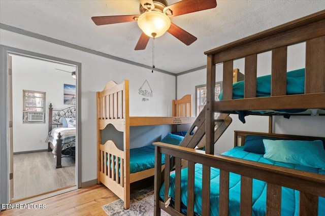 291 Marina Ln, Lafollette, TN 37766 - bedroom with ceiling fan, crown molding, light wood-type flooring, and a textured ceiling