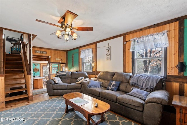 291 Marina Ln, Lafollette, TN 37766 - living room featuring wood walls, plenty of natural light, ceiling fan, and crown molding