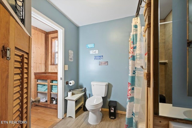 291 Marina Ln, Lafollette, TN 37766 - bathroom featuring hardwood / wood-style floors, toilet, and walk in shower