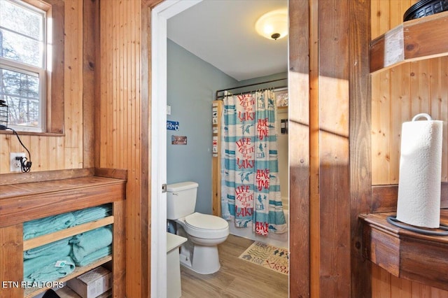 291 Marina Ln, Lafollette, TN 37766 - bathroom with walk in shower, wood walls, wood-type flooring, and toilet