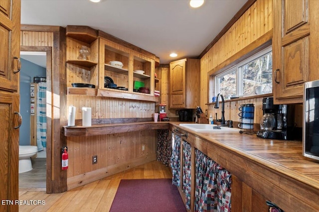 291 Marina Ln, Lafollette, TN 37766 - bar with light wood-type flooring, wood walls, and sink