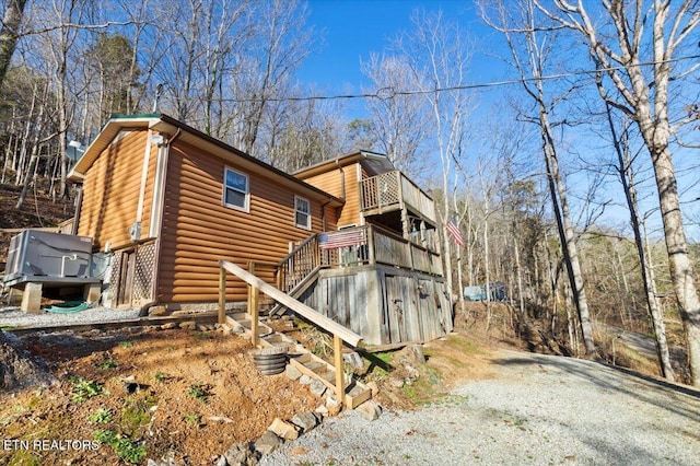 back of house with a balcony