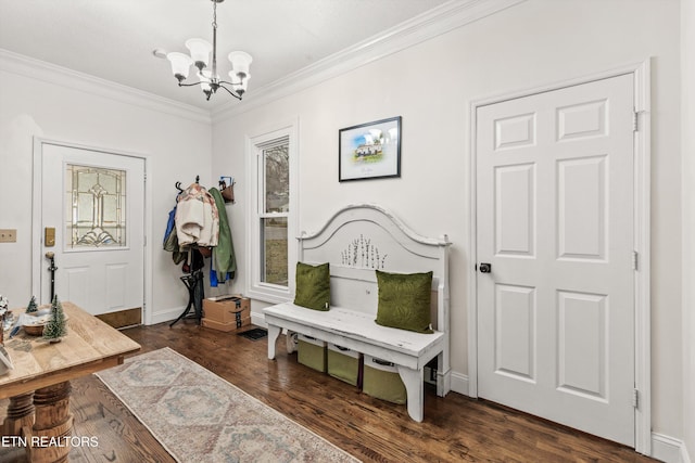 sitting room featuring a notable chandelier, dark hardwood / wood-style flooring, and ornamental molding