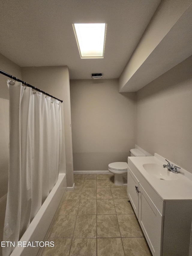 bathroom featuring toilet, tile patterned floors, visible vents, baseboards, and vanity