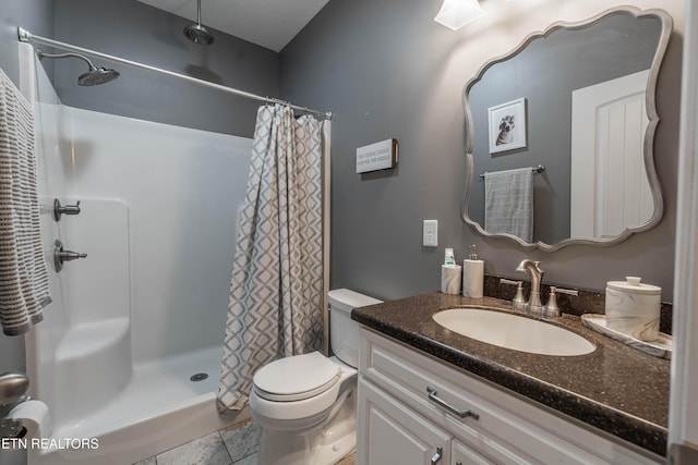 bathroom featuring a shower with shower curtain, vanity, tile patterned flooring, and toilet