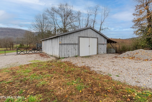 view of outbuilding with a mountain view