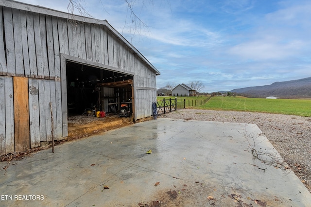 exterior space with a mountain view and a rural view