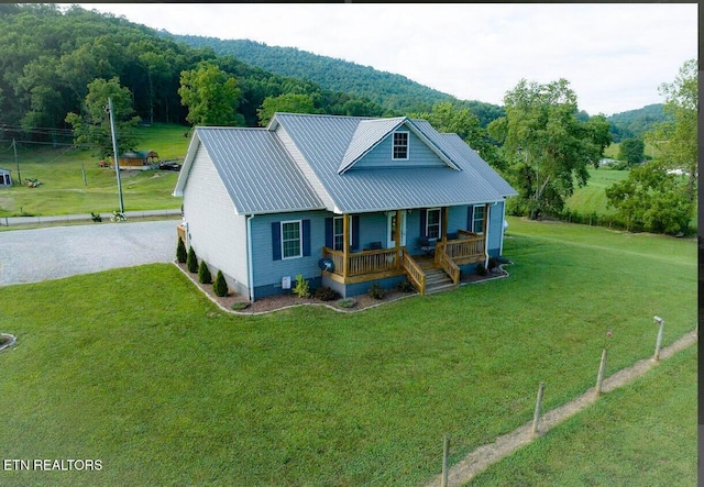 view of front of home with a front lawn and covered porch