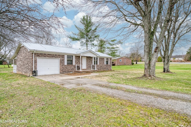 ranch-style home with a garage and a front yard