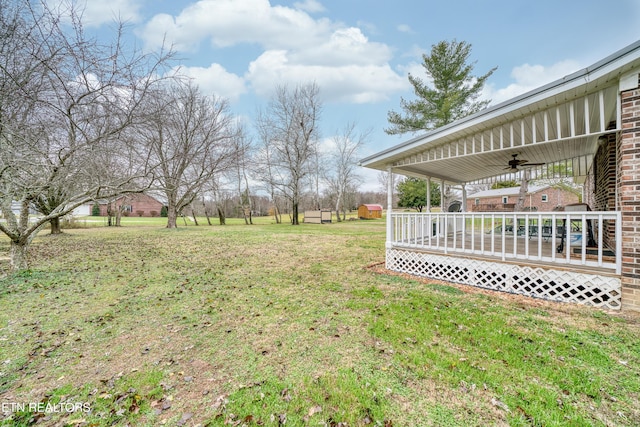 view of yard featuring ceiling fan