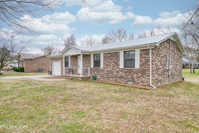 ranch-style house with a garage and a front lawn