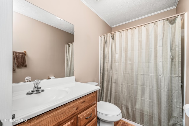 bathroom with hardwood / wood-style floors, vanity, toilet, ornamental molding, and a textured ceiling