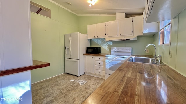 kitchen with white appliances, sink, ornamental molding, butcher block countertops, and white cabinetry