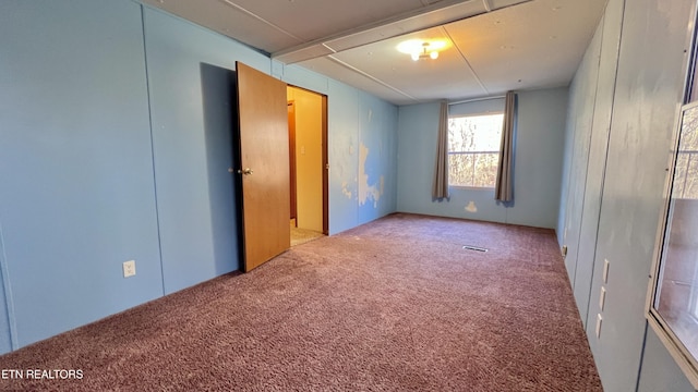 unfurnished bedroom featuring carpet