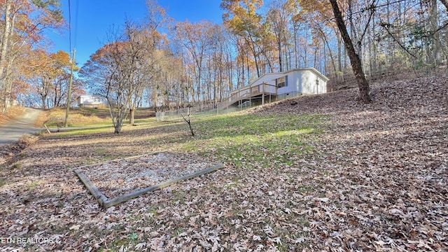 view of yard featuring a wooden deck